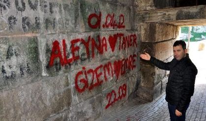Writings, sprayed shapes on historical castle's wall stirs debate