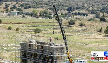 Symbol arch at capital of Lycia Union under restoration in Patara site